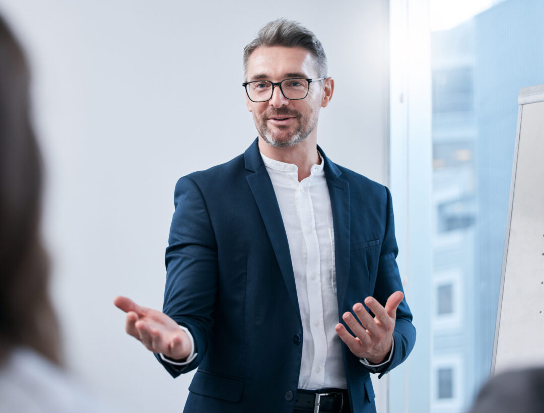 Shot of a mature businessman giving a presentation to his colleagues in an office.